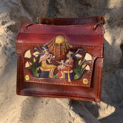 A fully handmade natural leather bag .