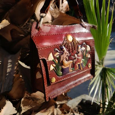 A fully handmade natural leather bag .