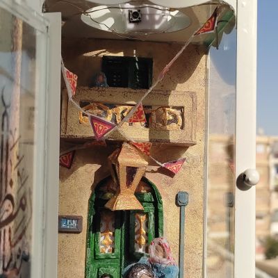 فانوس رمضان بداخله مشهد من شارع مصري فى رمضان 