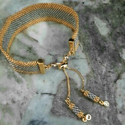 الأسورة الفضى بأطراف ذهبى من خرز الميوكى