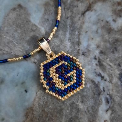 A necklace with a letter design by Miyuki beads