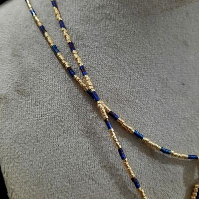 A necklace with a letter design by Miyuki beads