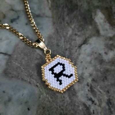 A necklace with a letter design by Miyuki beads