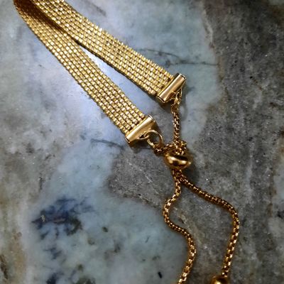 A gold-colored bracelet by Miyuki beads