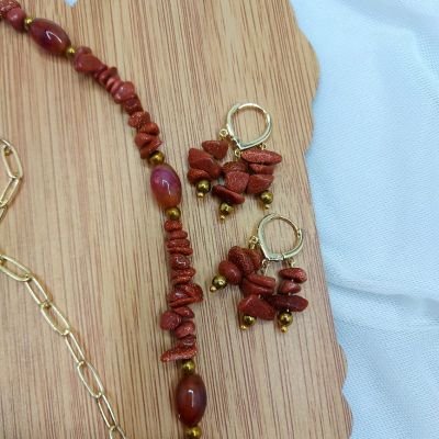 A set including a necklace, earrings, and a bracelet, made from broken agate stones