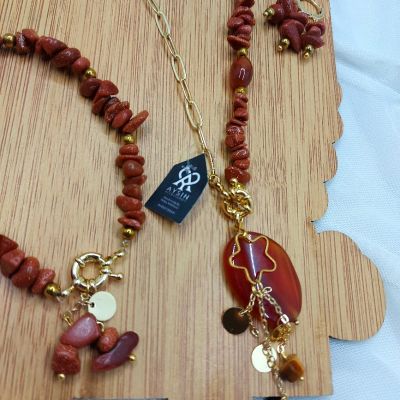 A set including a necklace, earrings, and a bracelet, made from broken agate stones
