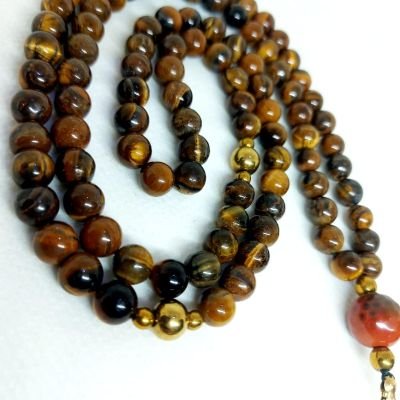 A 99-bead prayer necklace made from tiger eye stones.