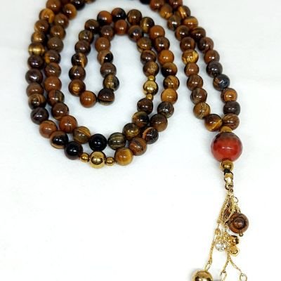 A 99-bead prayer necklace made from tiger eye stones.