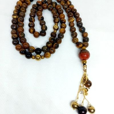 A 99-bead prayer necklace made from tiger eye stones.