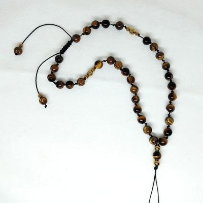 A mobile chain and prayer necklace made from tiger eye stones.
