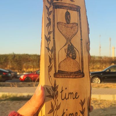 Butterfly in an Hourglass - جذع شجر زيتون