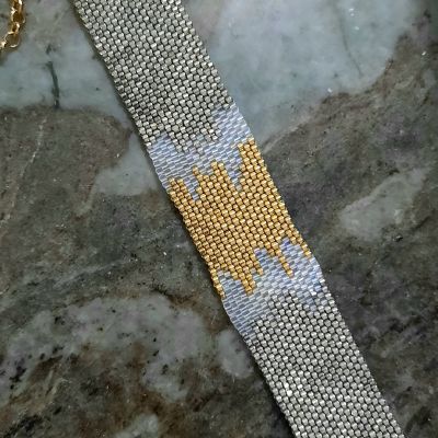 إسورة متداخلة الألوان الفضى والذهبى من خرز الميوكى