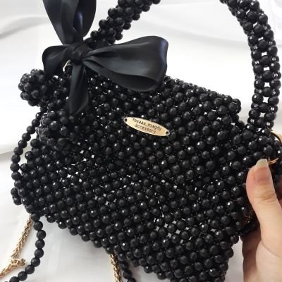 شنطة خرز اسمر بفيونكة