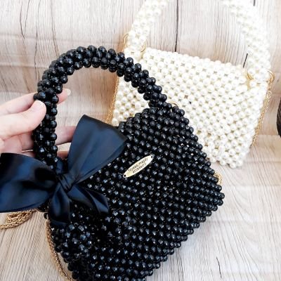 شنطة خرز اسمر بفيونكة