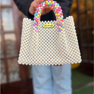 شنطه بخرز مط و يد ملونه 