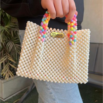 شنطه بخرز مط و يد ملونه 