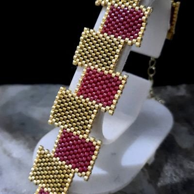 A set of honey and dark red rectangular Miyuki beads