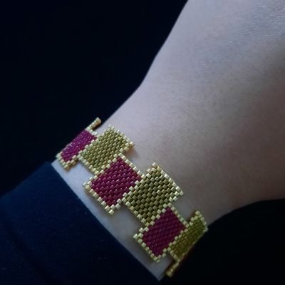 A set of honey and dark red rectangular Miyuki beads