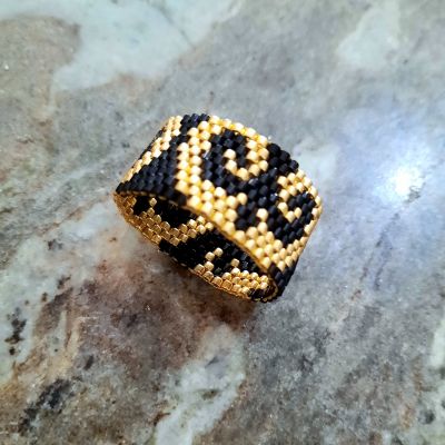 A black and gold Arabic-designed set of Miyuki beads