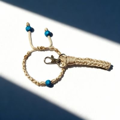 مجموعة اسورة وسلسلة مفاتيح بعقدة مربعة ذهبي