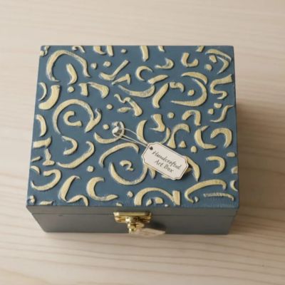 Wooden box decorated with embossed letters