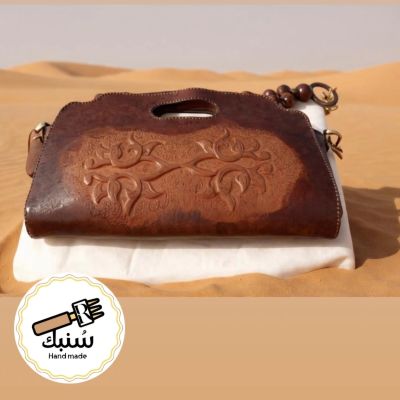 Tooled leather clutch 