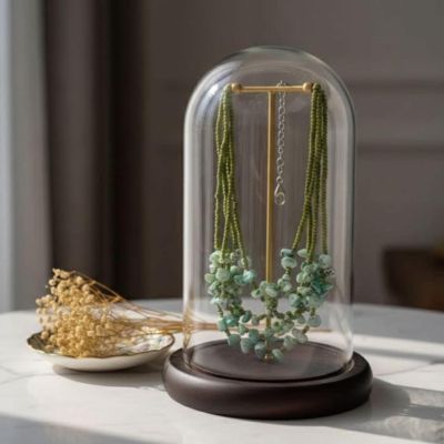 Holding shades of green necklace