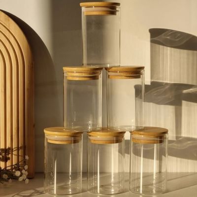 &ldquo;Clear white jar with a light wood lid&rdquo;