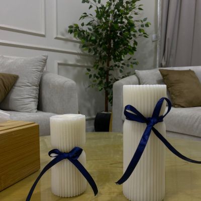 Elegant white decorative candle infused