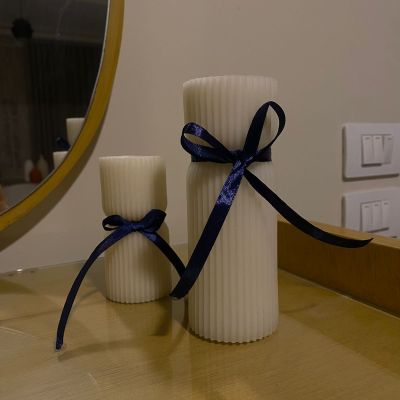 Elegant white decorative candle infused