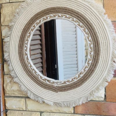 Mirrors with macrame threads