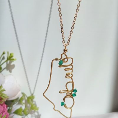 A copper chain in the shape of a map of Palestine