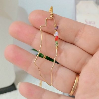 A copper chain in the shape of a map of Palestine