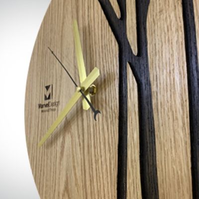 ساعة حائط من خشب الأرو