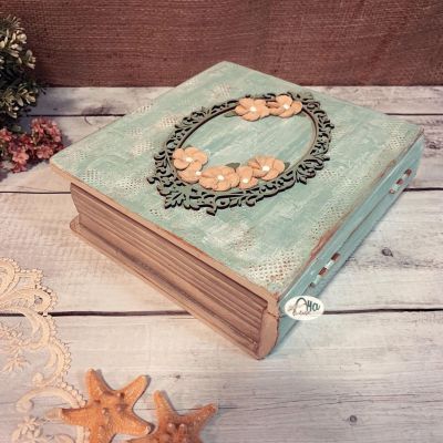 “Wooden box adorned with raised Russian floral designs