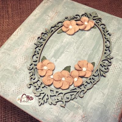 “Wooden box adorned with raised Russian floral designs