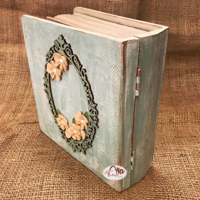 “Wooden box adorned with raised Russian floral designs