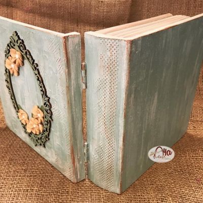 “Wooden box adorned with raised Russian floral designs