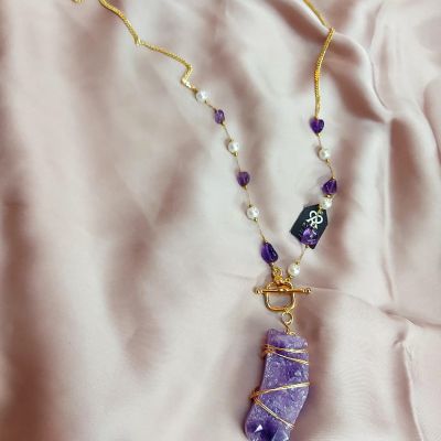 The necklace is made of amethyst stones.