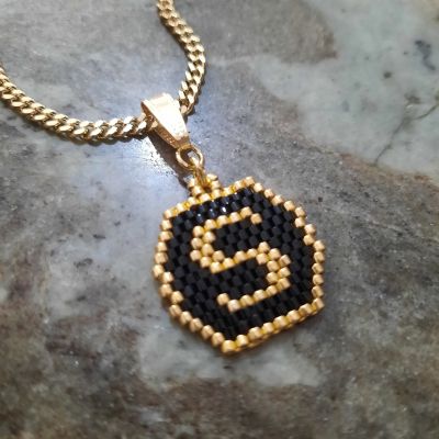 Black and gold letters by Miyuki beads