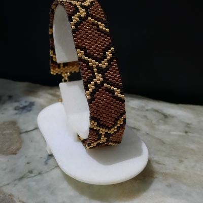 مجموعة تصميم جلد الثعبان باللون الأحمر الغامق من خرز الميوكى