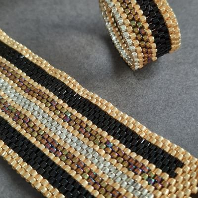 Design with shiny colorful lines with golden by Miyuki beads