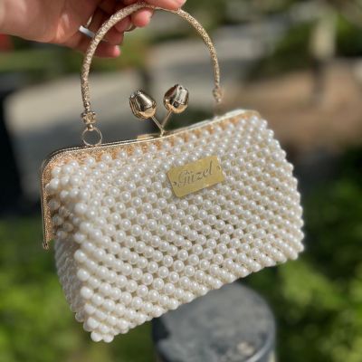 شنطة لولي اوف وايت فريم دهبي يد مدوره 