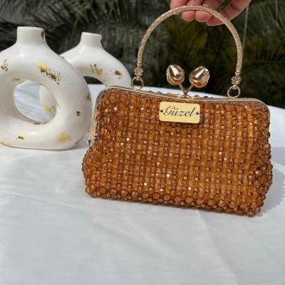 A bag of crystal with a gold frame