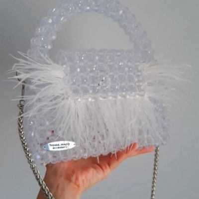 Crystal clear bag with feathers and fixed handle