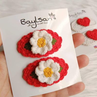 double clips.. covered with a flower.. red