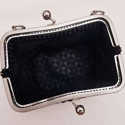 Crochet evening bag with metal frame