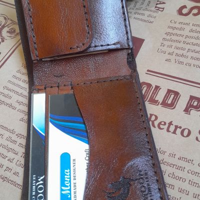 A men's pocket wallet made of natural leather with the name and photo engraved on it 