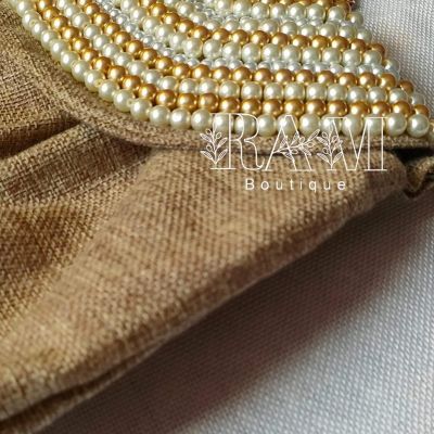 شنطة مُطرزة بـ اللولي