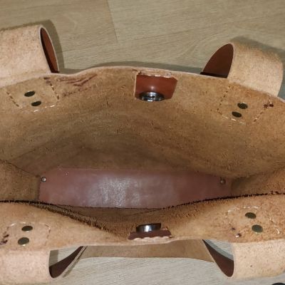 "Handmade natural leather bag."